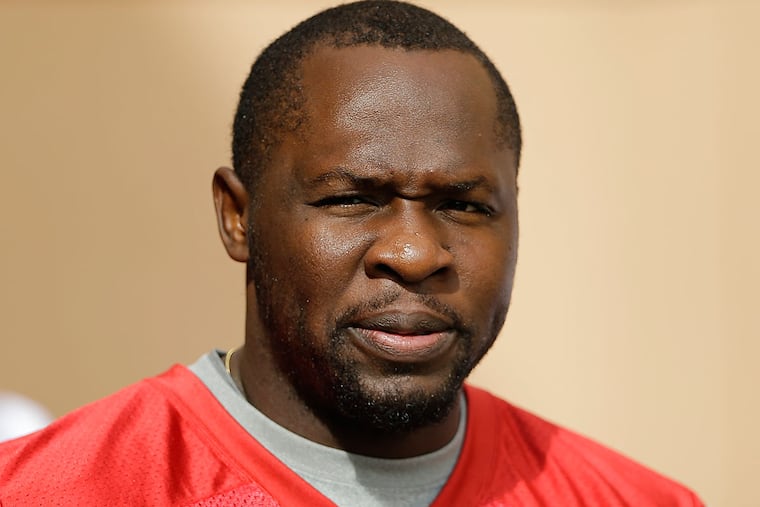 Philadelphia Eagles quarterback Thad Lewis walks onto the field at the
NFL football team's practice facility, Wednesday, Sept. 30, 2015, in
Philadelphia.
