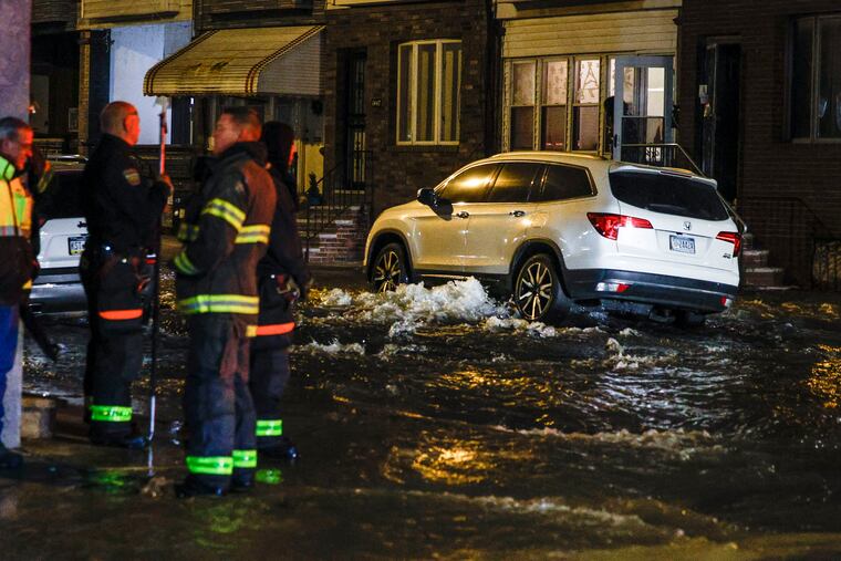 Philadelphia Water Department workers and city firefighters responded to the scene of a water main break at 28th and Dickinson Streets Friday night.