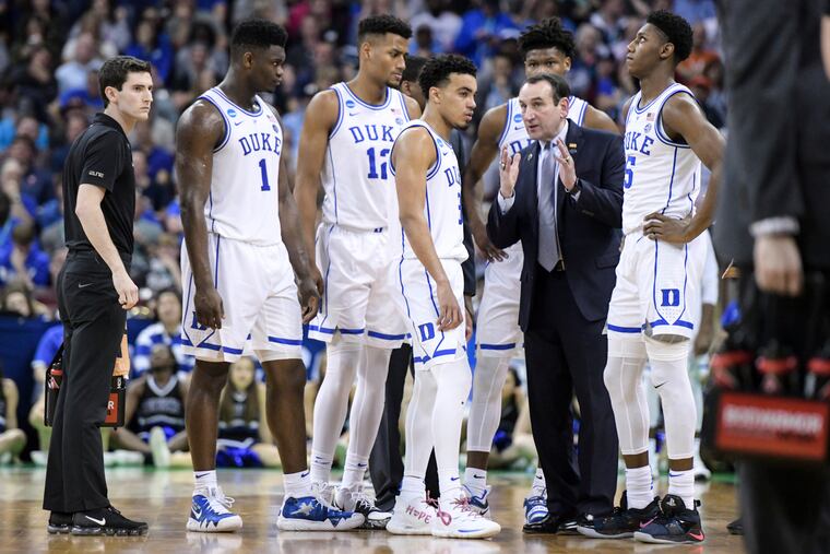 Duke coach Mike Krzyzewski talks with players during a timeout during the second half of the team's second-round game against Central Florida in the NCAA men's college basketball tournament Sunday, March 24, 2019, in Columbia, S.C. Duke won 77-76. (AP Photo/Sean Rayford)