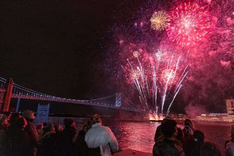 Families and friends gather from all over to watch the firework show over the Delaware River on New Years Eve at Penn’s Landing in Philadelphia on Wednesday, Dec. 31, 2025.