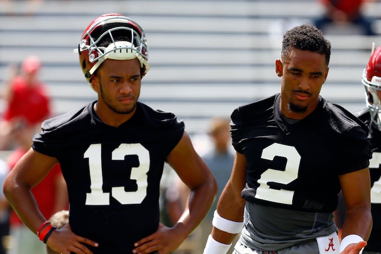 Alabama quarterback Jalen Hurts (2) and quarterback Tua Tagovailoa (13) runs drills during a NCAA college football practice, Saturday, Aug. 4, 2018, in Tuscaloosa, Ala. (AP Photo/Butch Dill)