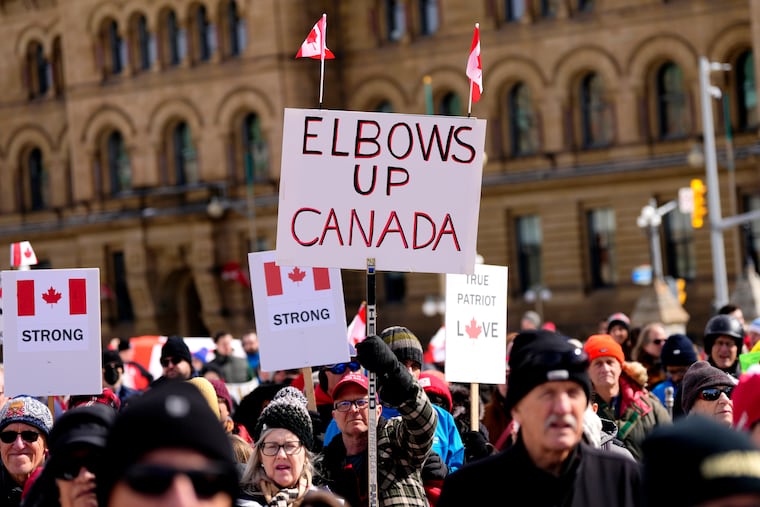 People rally in response to U.S. President Donald Trump's threats to Canadian sovereignty on Parliament Hill in Ottawa, March 9, 2025. Prime Minister Mark Carney's defiant stance is widely popular with Canadians.