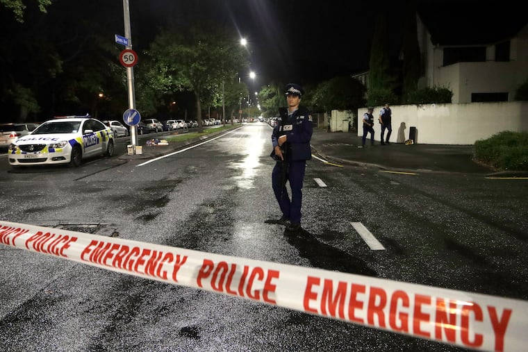 A police officer patrols at a cordon near a mosque in central Christchurch, New Zealand, on Friday after multiple people were killed in mass shootings at two mosques there.