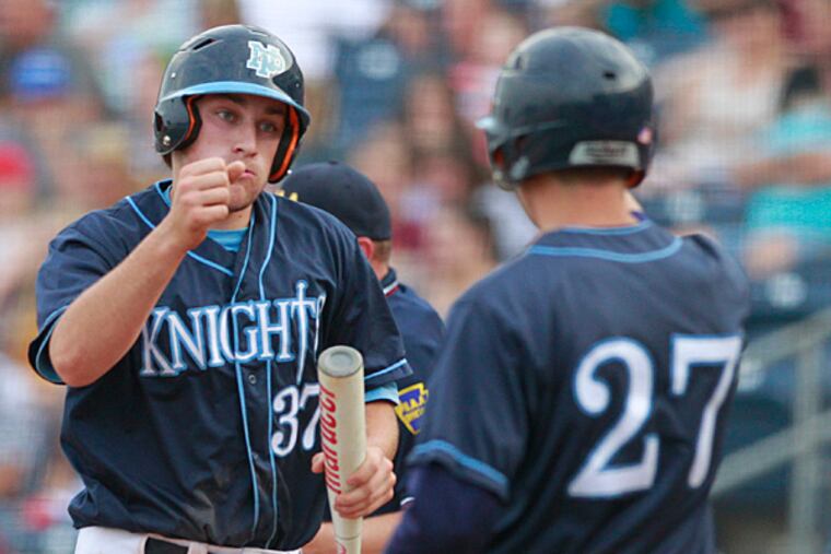 In the PIAA Class AAAA Baseball Final, Jake Schuster, left, of North
Penn is congratulated by teammate Mike Christy after scoring in the
2nd inning at Medlar Field at Lubrano Park on June 12, 2015. This gave
North Penn a 2-0 lead over Wyoming Valley. (Charles Fox/ Staff
Photographer)