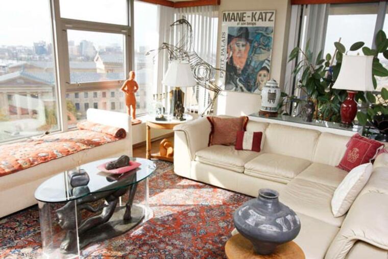 Bebe Weiss' living room is full of art: The coffee table at left, pottery at right, and a wide view of the Art Museum.