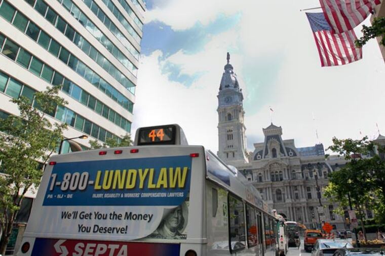 Picture of a SEPTA bus with the Lundy Law advertisement on the rear. Photograph taken along Market St. west of city hall near 15th St. in Philadelphia on Tuesday, August 27, 2013. ( ALEJANDRO A. ALVAREZ / STAFF PHOTOGRAPHER )