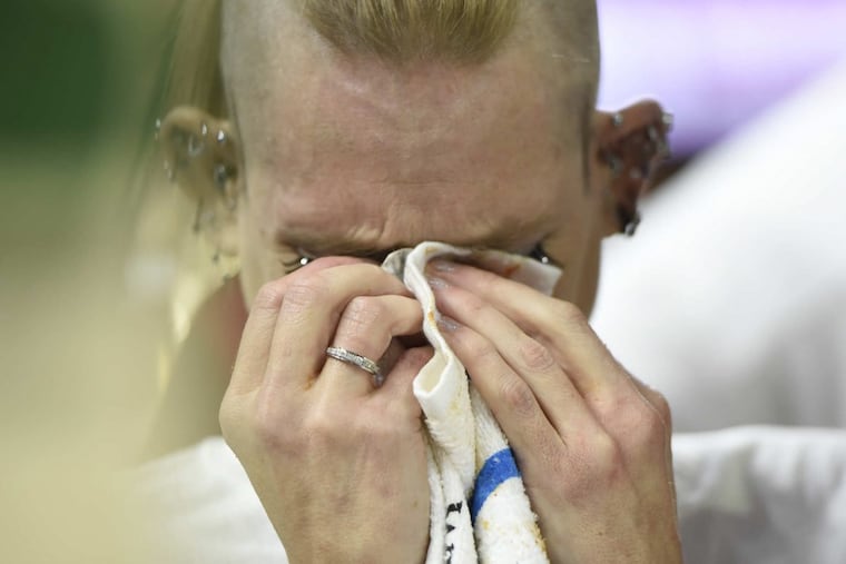 An emotional Molly Schuyler wipes her eyes after winning Sportsradio 94 WIP’s 26th annual Wing Bowl.