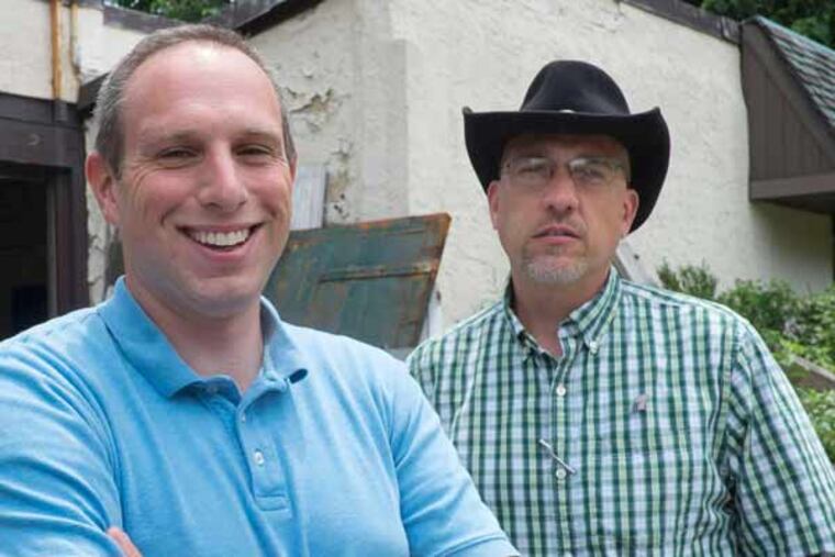 The Seibert brothers, Scott (left) and G.C., at the warehouse they plan to convert into 25 units with “passive-house” design. ED HILLE / Staff Photographer