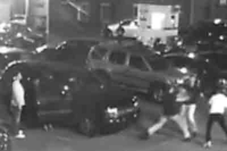 Police released this video of the attack on two friends in a parking lot by three men.