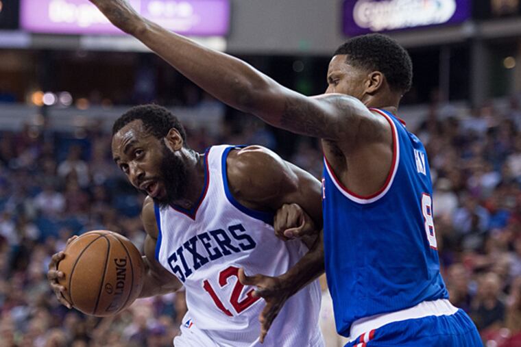 Philadelphia 76ers forward Luc Richard Mbah a Moute (12) dribbles against Sacramento Kings forward Rudy Gay (8) during the second quarter at Sleep Train Arena. (Kyle Terada/USA Today)