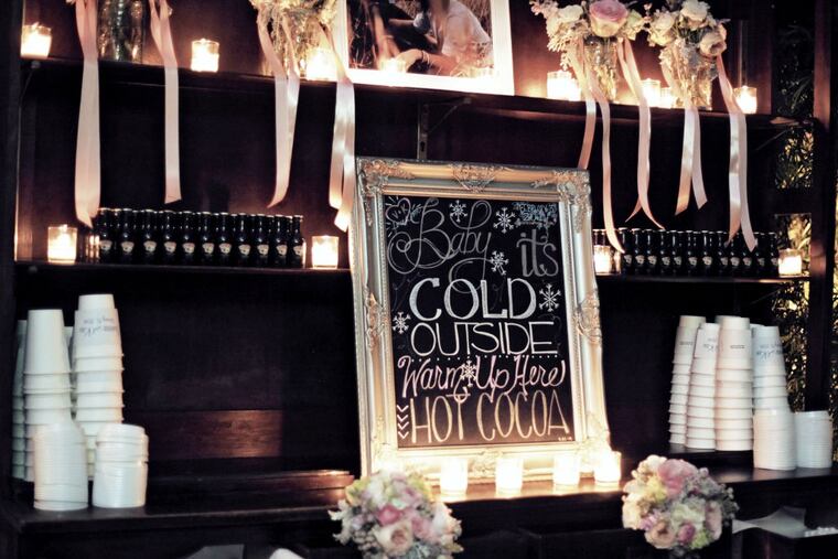 Truly You Events assembled a hot-chocolate station for a late-nigh treat to go for guests at a winter wedding. Add-ons included whipped cream, marshmallows and mini bottles of Baileys. (Peter Van Beever)