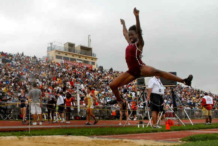 Abington sophomore Jordan Matthews competes in the preliminaries of the AAA girls' long jump at Shippensburg University's Seth Grove Stadium. She won with a jump of 18 feet, 41/2 inches.