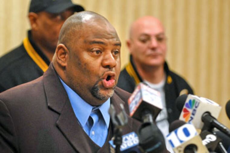 TWU Local 234 president Willie Brown makes a statement in front of a union banner yesterday saying "the key issue is pensions and how worker pensions
will be funded." (Tom Gralish / Staff Photographer)