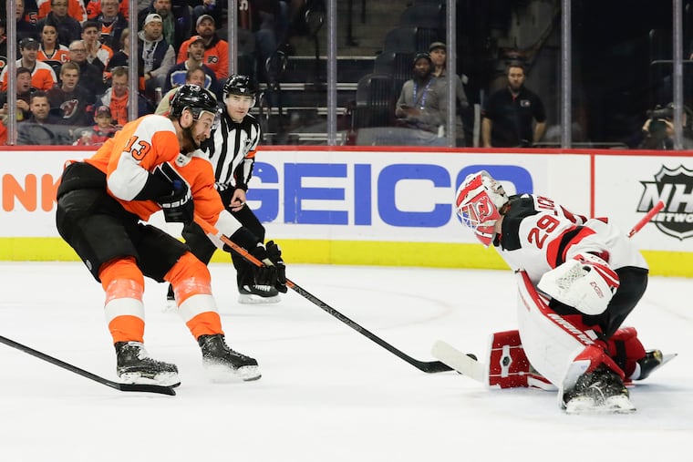 Flyers center Kevin Hayes (left) shoots on Devils goaltender Mackenzie Blackwood last season. Hayes said having the same coaching staff back will make a big difference this season.