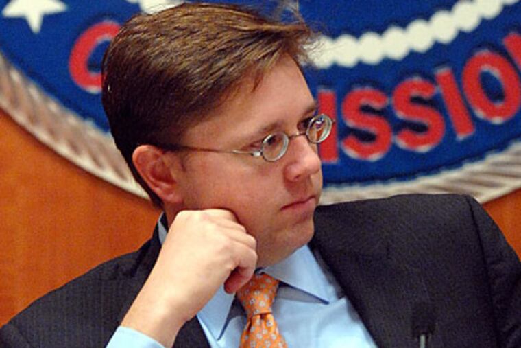 Federal Communications Commission chairman Kevin Martin has limited Comcast to 30 percent of the national pay-television market, despite an earlier court ruling that overturned an ownership cap. (Kevin Wolf/AP)