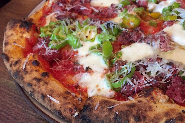 Lamb sausage and shishito pepper pizza on sourdough crust at Petruce et al.
