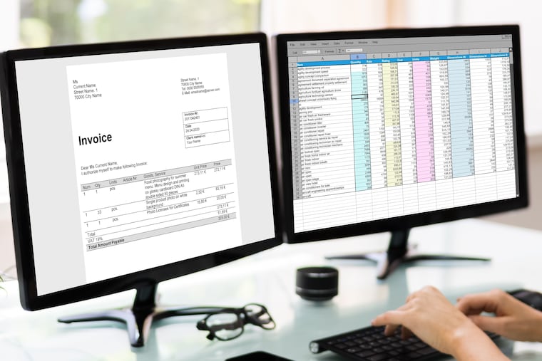 An analyst works with a spreadsheet on the computer. Deciding on the right accounting software for your business can be complicated.