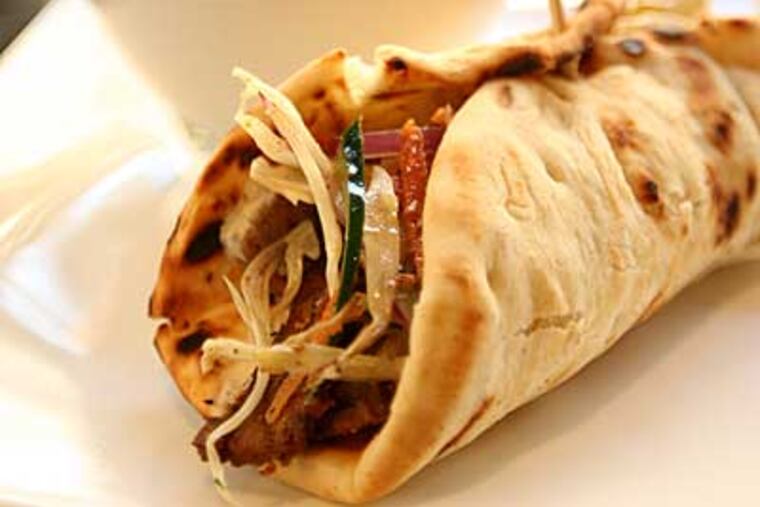 Slate's menu includes a homespun lamb gyro, a nod to chef Eric Paraskevas' Greek heritage. (Michael Bryant/Staff Photographer)