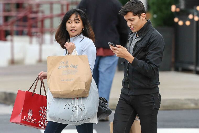 Charm Griarte (left) of Philadelphia and friend Fran Cortes of Media shop at the King of Prussia mall.