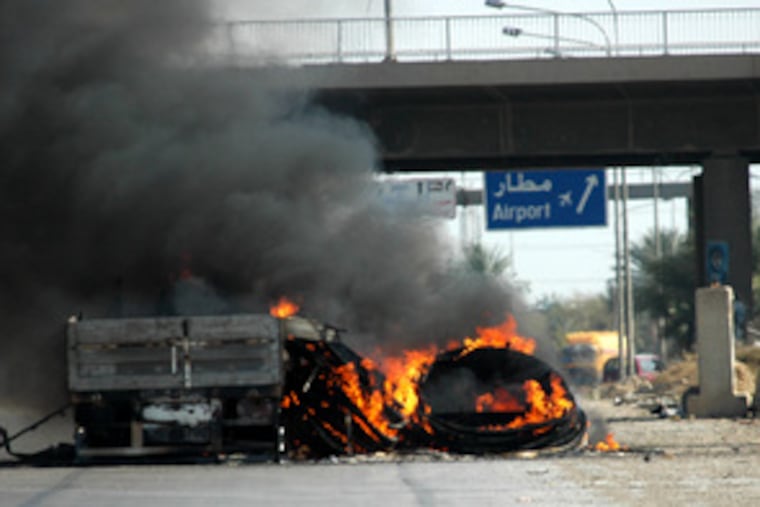 A truck carrying supplies for the U.S. military burned on an expressway in Baghdad yesterday. Unknown gunmen attacked and set it on fire, Iraqi police said.