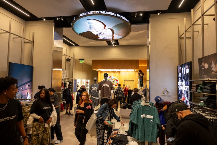 People shop inside of the new World of Flight store along Walnut Street in Philadelphia on Oct. 10.