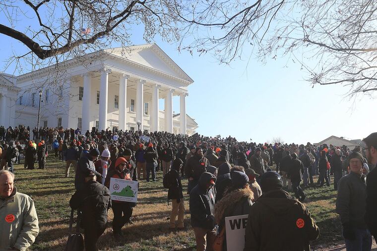 Gun rights protestors gather under the Virginia State Capitol for a rally in support of Second Amendment rights on Monday.