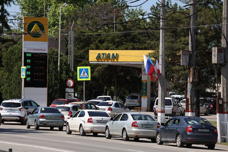 Cars line up at a petrol station in Simferopol, Crimea, Friday, June 12, 2026.