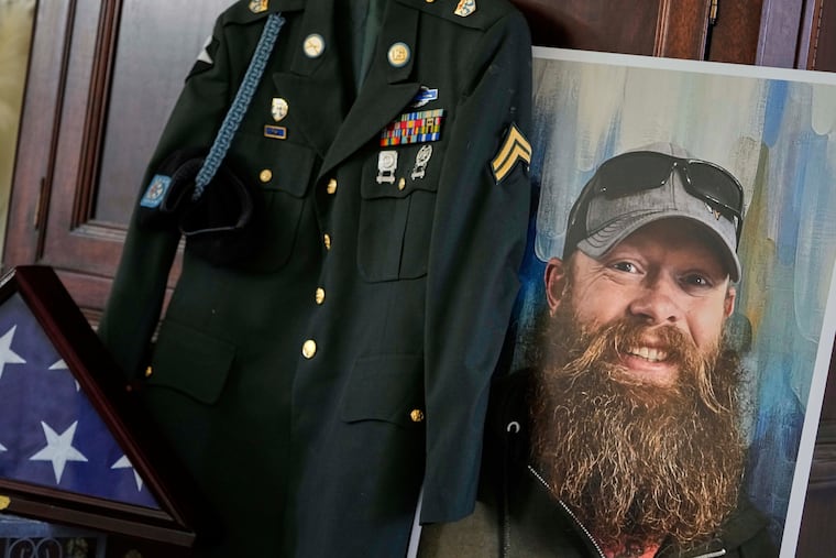 The Army dress uniform and photo of the late Christopher Pelkey is shown at his mother's home on May 7, 2025, in Chandler, Ariz.