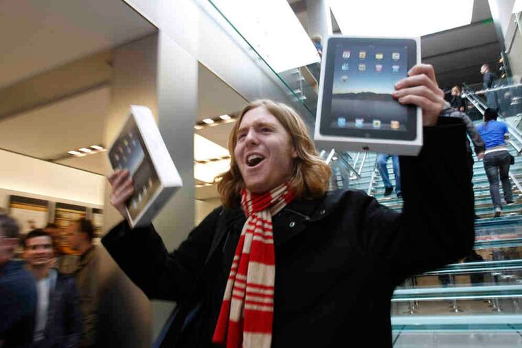 Earliest adopter: On April 3, 2010, Andres Schobel held up two iPads as one of the first customers on the first day of sales at an Apple Store in San Francisco. Apple said it sold more than 300,000 iPads that Saturday, the day they debuted across the country.