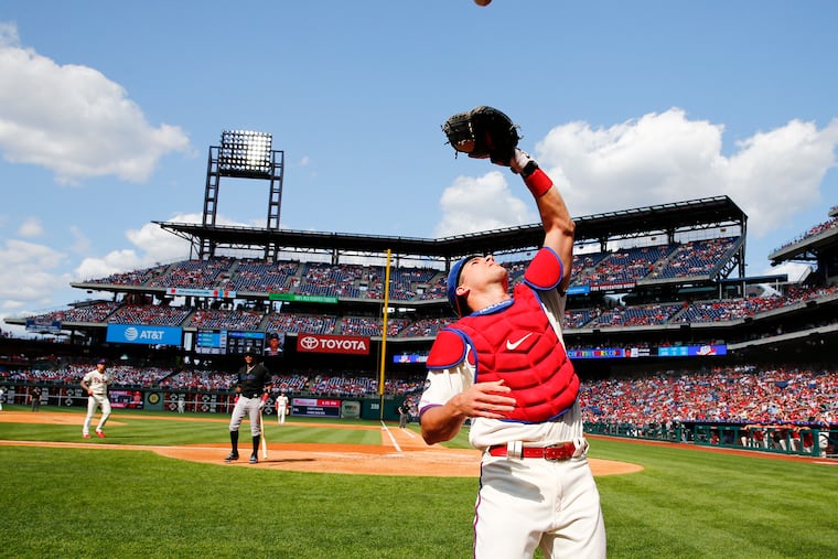 Phillies catcher J.T. Realmuto waits to catch Miami Marlins Starlin Castro's second-inning foul fly ball on Saturday, June 22, 2019 in Philadelphia.