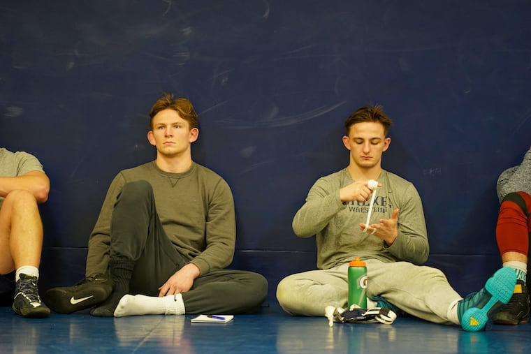 Brothers Sean O’Malley (left) and Mickey O’Malley during practice at Drexel’s Daskalakis Athletic Center.