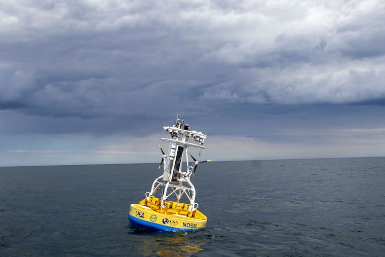 In this 2018 image provided by Woods Hole Oceanographic Institution, a buoy used to gather data floats in the Atlantic Ocean.