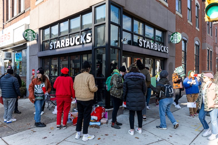 Starbucks workers who have been organizing unions in recent years have complained of understaffing and other job-quality issues, which similarly arose in the Federal Reserve's recent focus groups with low-income and moderate-income workers. In this photo, Starbucks Workers Union members picket at a store on South Street and 22nd Street in Philadelphia on Nov. 17, 2022.