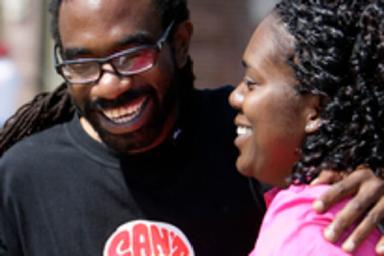 Francina Girard-Williams & husband Damon Williams share jubilant smiles after she passed her naturalization exam on Wednesday.
