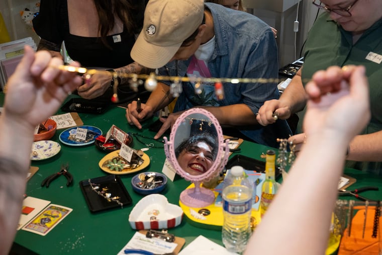 Meghan Solomon reviews her jewelry piece during a workshop with artist Holly Simple at the Bok Building on Thursday, Sept 25, 2025 in Philadelphia.