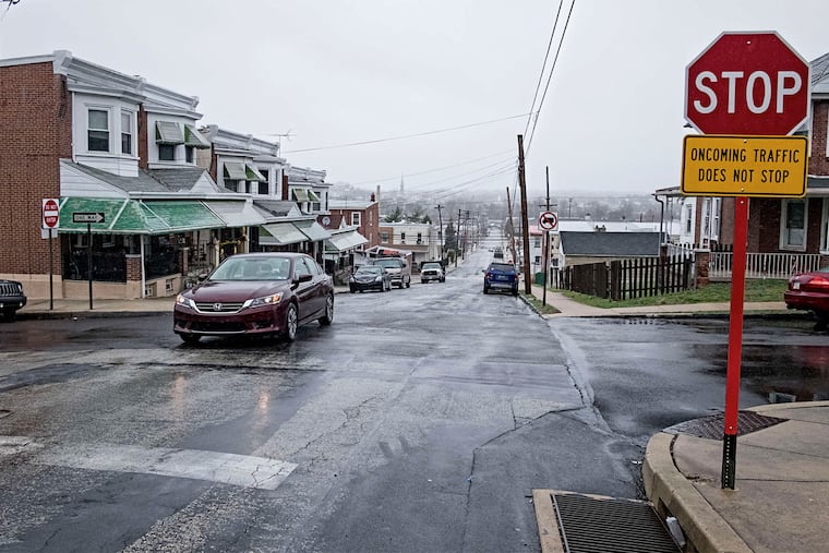 A rainy-day view in Bridgeport from Sixth and Mill Streets. A few blocks away are the borough's newer townhouses.