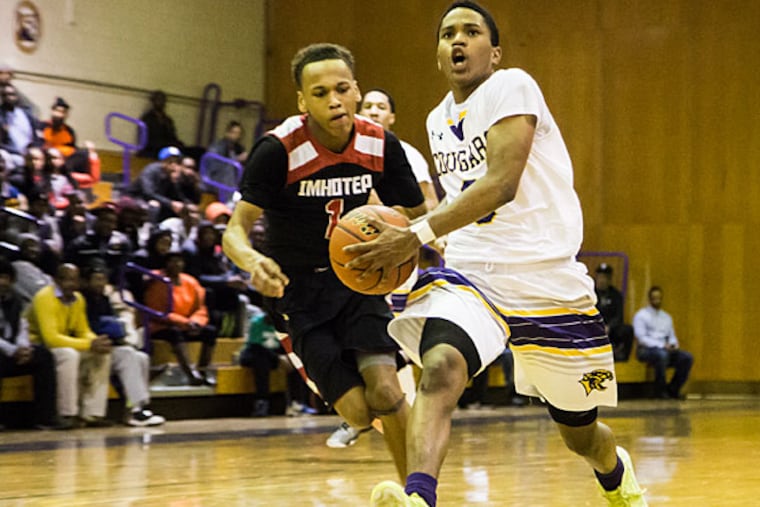 Martin Luther King High School's Tyheem Harmon drives to the paint
against Imhotep Charter High School on Thursday, January 15, 2015.
MLK won 55-52. (Andrew Thayer/Staff Photographer)