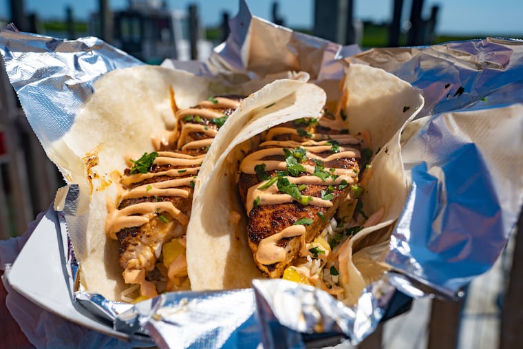 Blackened Swordfish taco with two 8" tortillas served with homemade pineapple mango salsa, lime slaw, and chipotle aioli at Hooked Up Seafood located on the Jersey shore in Wildwood, NJ