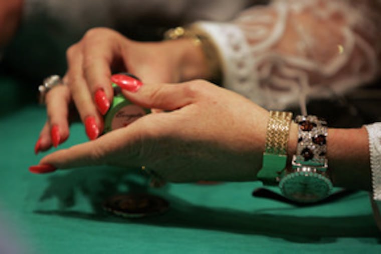 Counting her chips at one of the Borgata's tables is Nancy Todd Tyler of Las Vegas. The Borgata Poker Open offers a first prize of $1.4 million and total prize money of $5 million. The 15-day tournament drew 1,192 players from all over the country.