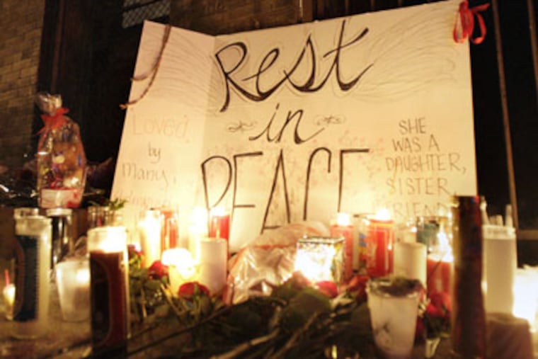 Memorial setup near Sabina Thompson's home on 4th Street. She was killed early Wednesday after a night out with friends. (Alejandro A. Alvarez / Staff Photographer)