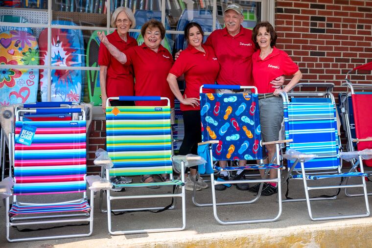 Dalrymple family members pose for a photo at work at Dalrymple's Card & Gift Shoppe in Sea Isle City,Thursday, July 20, 2023. From left are: Valerie Dalrymple Gaughen; .Angel Dalrymple; Nicole Dalrymple Conahan; .Charles Dalrymple; and Barbara Dalrymple. Jersey Shore towns rely on quaint but important general stores to give vacationers what they need.