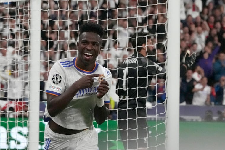 Real Madrid's Vinicius Junior celebrates after scoring his side's first goal during the Champions League final soccer match between Liverpool and Real Madrid at the Stade de France in Saint Denis near Paris.