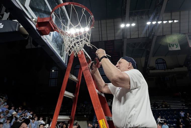 Bill Koch helps cut down the net after Father Judge won the Catholic League championship over Neumann Goretti on Sunday at the Palestra.