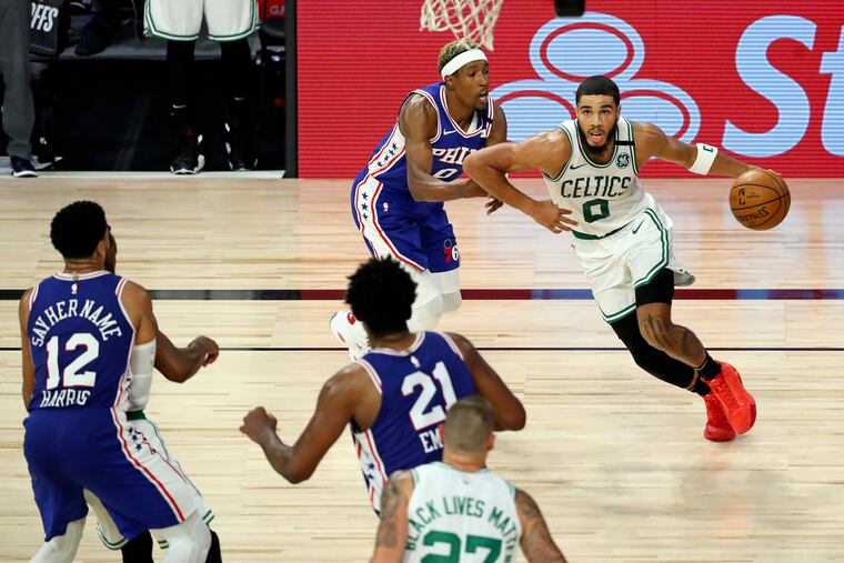 Boston's Jayson Tatum moves around the Sixers' Josh Richardson en route to the basket. The Sixers lost game 3 of their first-round playoff series to the Celtics Friday night to fall into a 3-0 hole. (Kim Klement / USA Today Sports via AP Pool)