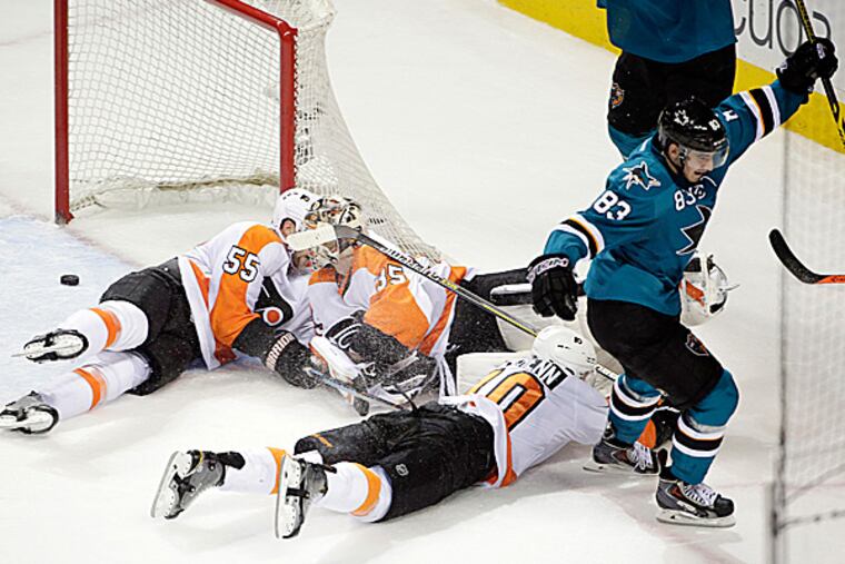 Sharks left wing Matt Nieto scores the game-winning goal on Flyers goalie Steve Mason during the third period. (Marcio Jose Sanchez/AP)