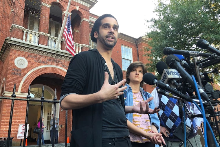 Phil Davis and Rachael Pacella, reporters who survived last year's shooting at the Capital Gazette newspaper, talk to reporters outside Anne Arundel County Circuit Court in Annapolis, Md., after the gunman pleaded guilty to all 23 counts of an indictment in the case on Monday, Oct. 28, 2019. Jarrod Ramos is moving forward with a plea of not criminally responsible by reason of insanity, which will be decided by a jury next month.