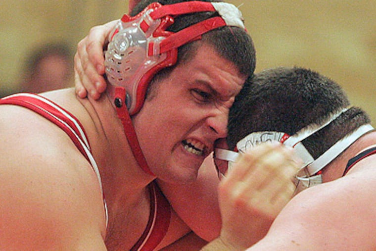 285 lbs. weight class Paulsboro wrestler Nicholas Curl takes on
Haddonfield's Nicholas Conquest. (Bonnie Weller / Staff Photographer )