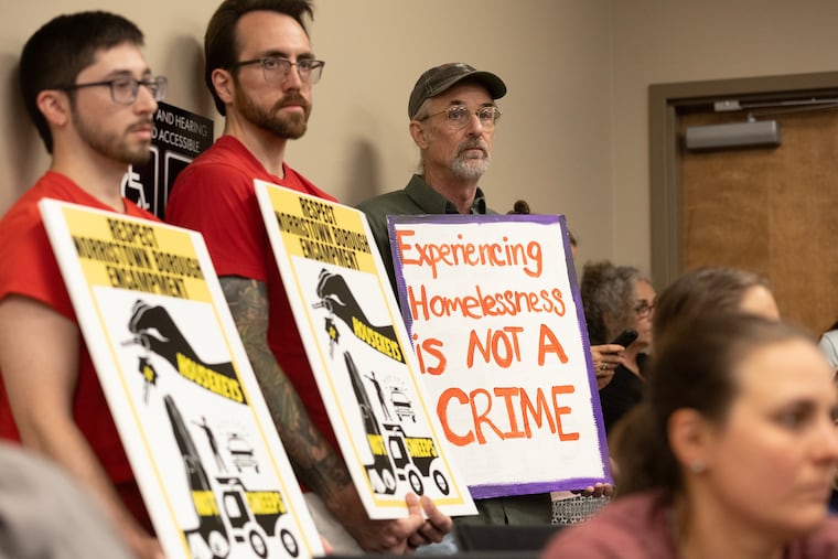 Advocates for the homeless, including Bill England (right) filled Norristown Borough Council chambers on June 6, 2023 after council president Thomas Lepera proposed busing people who are homeless in Norristown to Villanova University, where an advocate teaches.
