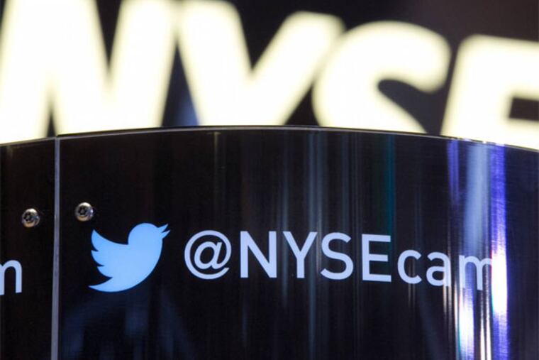 The Twitter bird logo is on an updated phone post on the floor of the New York Stock Exchange, Wednesday Nov. 6, 2013. Twitter is expected to price its initial public offering some time Wednesday night. The company recently raised its price range to $23-$25 per share, following strong investor demand, and is expected to start trading on the New York Stock Exchange on Thursday. (AP Photo/Richard Drew)