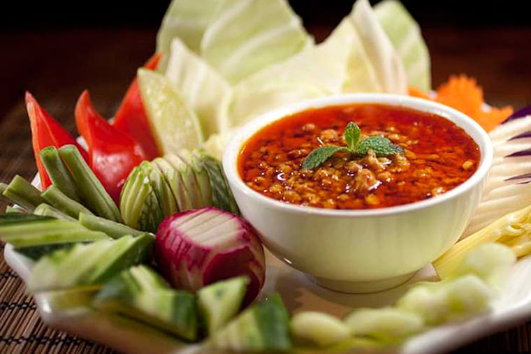 Prah-hok kahteeh is caramelized ground pork touched with fermented monkfish and curried with coconut.